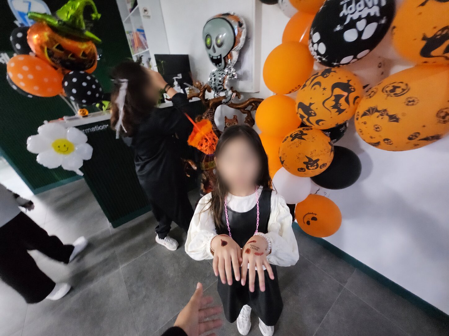 Halloween party, with children’s faces protected